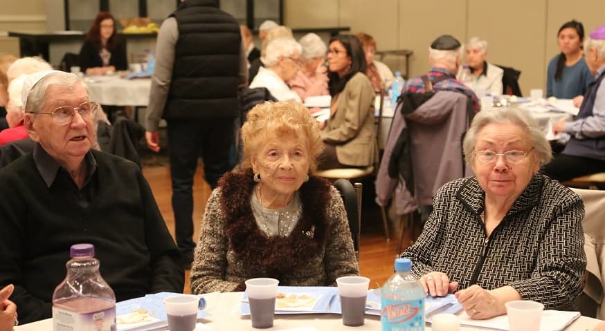 Shlomo (left) pictured with Regina Salomon (middle) and Henia Gerson (right) in 2017